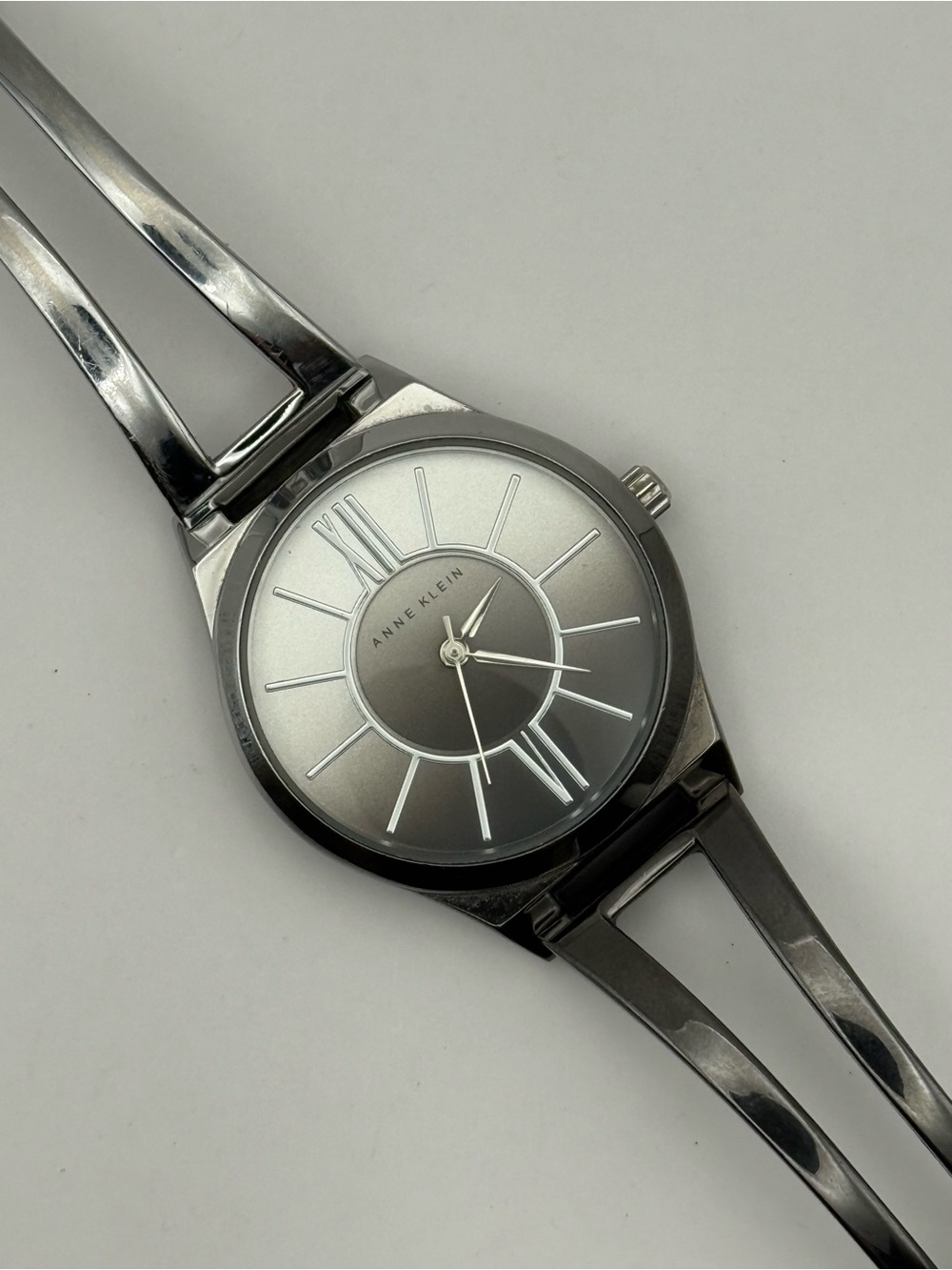 Anne Klein Women's Silver-Tone and Gunmetal Open Bangle Watch (New Battery)